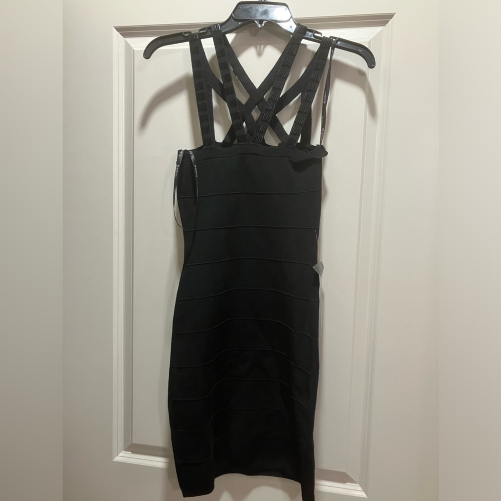Bebe dress with beaded straps.  Size-M.  Color-black.  New with tags